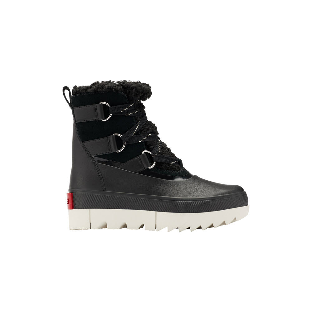 Sorel Joan of Arctic Next Boot Black - Womens with shearling cuff and white sole, featuring metal eyelets and laces, isolated on a white background.