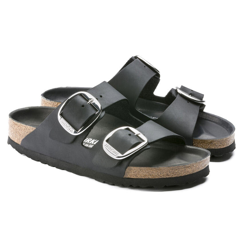 Pair of Birkenstock Arizona Big Buckle Black Oiled sandals, featuring an oiled nubuck leather cork footbed and a white background.