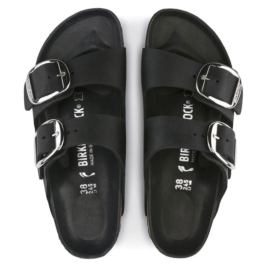 A pair of black Birkenstock Arizona Big Buckle sandals with a two-strap design, adjustable straps, and buckles viewed from above.