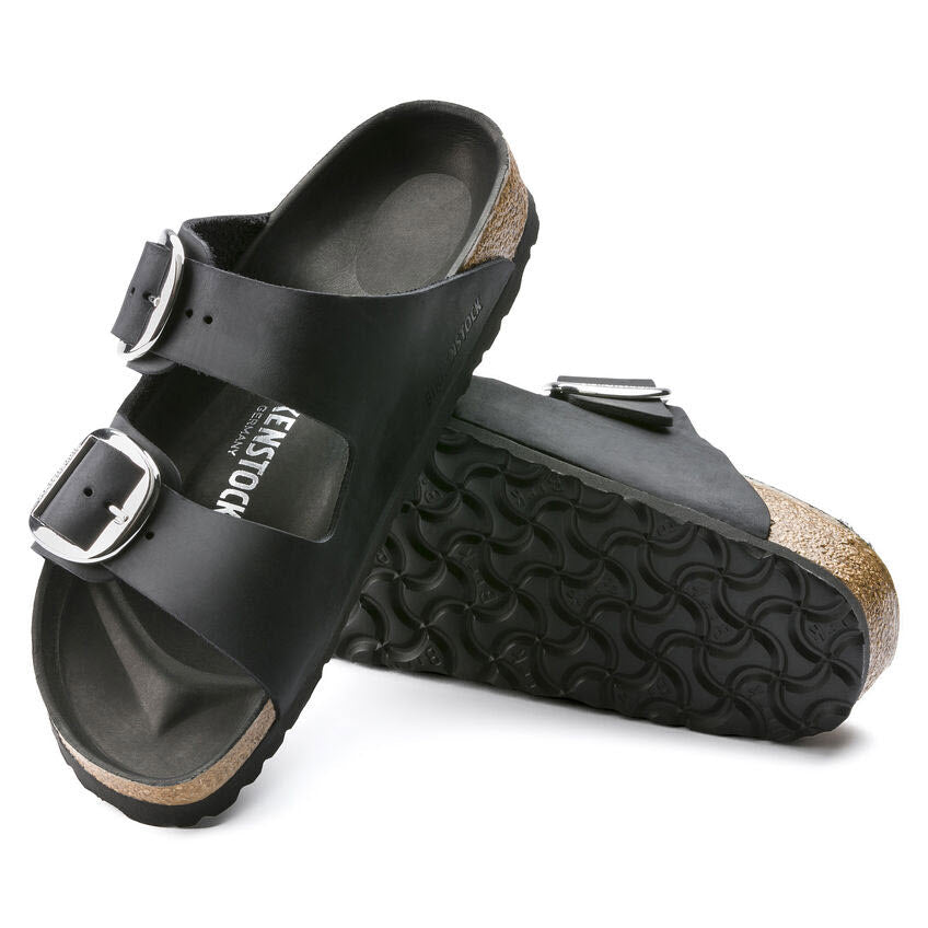 A pair of black Birkenstock Arizona Big Buckle sandals with a two-strap design on a white background.