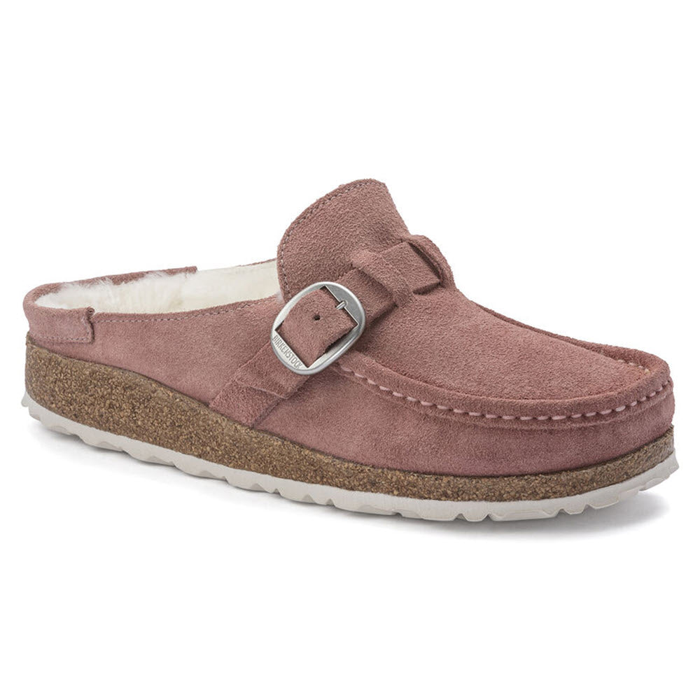 A single Birkenstock Buckley Shearling Pink Clay clog with a buckle strap and white shearling lining on a white background.