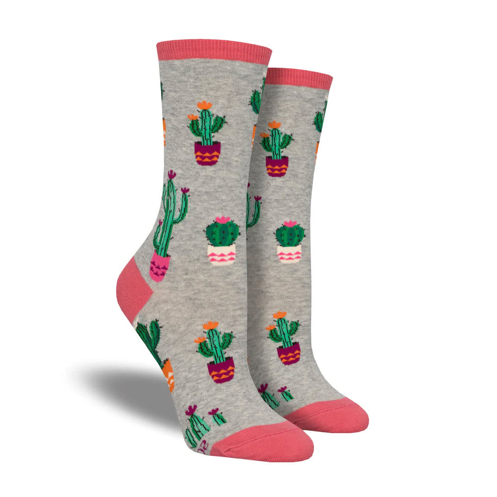 A pair of Socksmith Court of Cactus socks light gray in size 9-11, with cactus patterns and pink toes and heels, ideal for women&#39;s shoe sizes, featuring a comfortable fiber content.