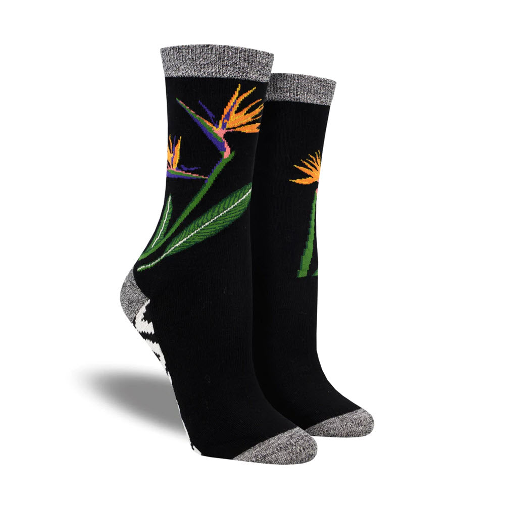 A pair of SOCKSMITH BIRDS OF PARADISE SOCKS BLACK with colorful floral embroidery and grey toes and heels, isolated on a white background, sized 9-11 fitting women&#39;s shoe size 5-10.5 by Socksmith.