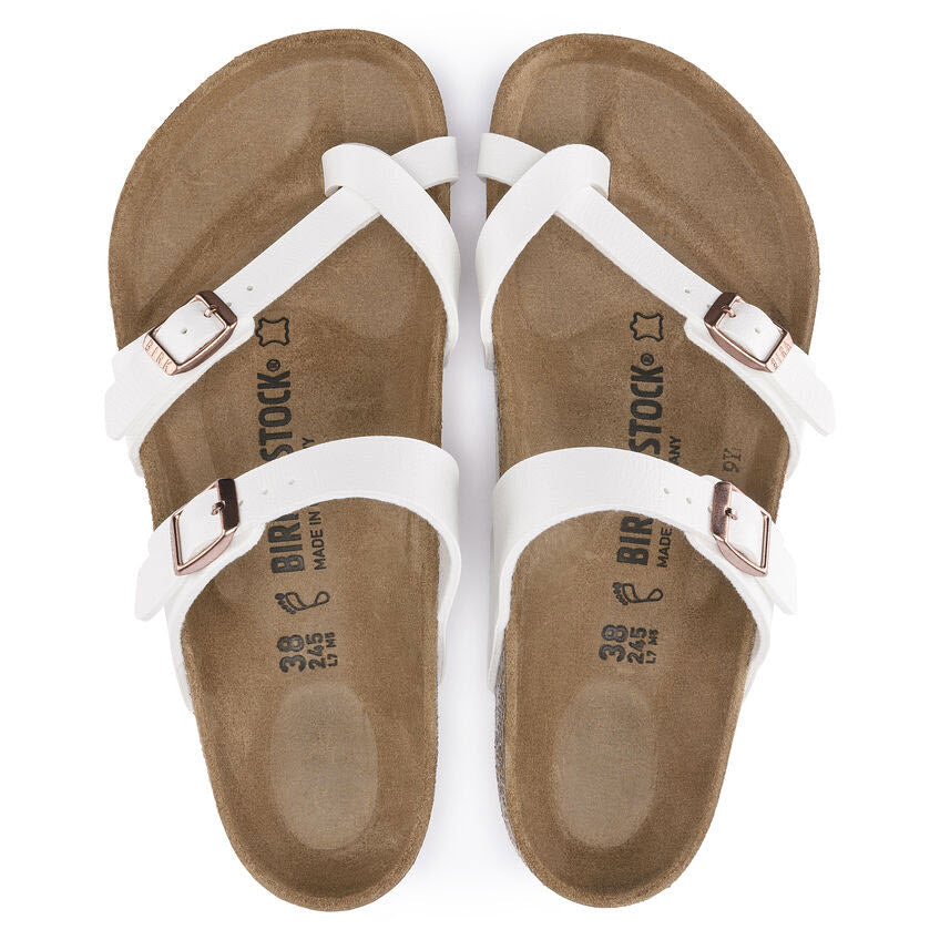 A pair of white Birkenstock Mayari sandals with buckle straps viewed from above.