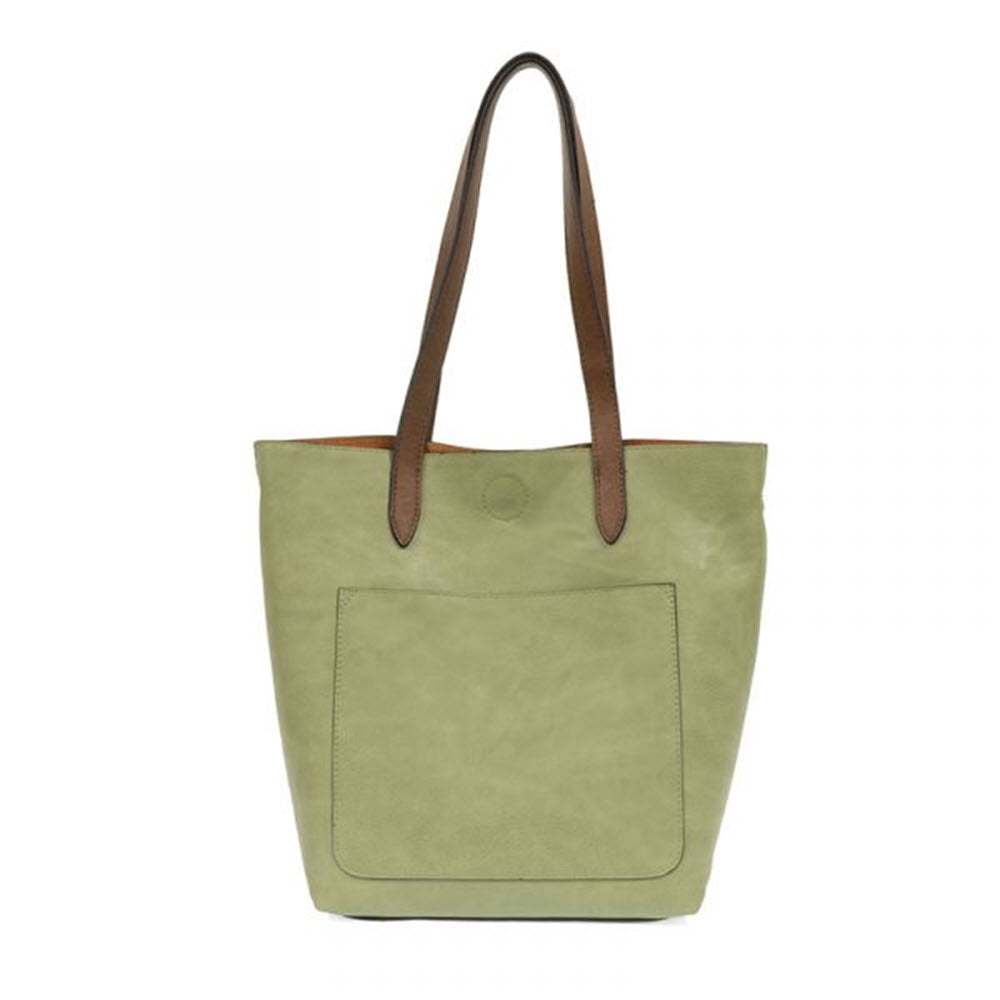 Eucalyptus green Joy Susan Tally bag with brown handles and a roomy front pocket.