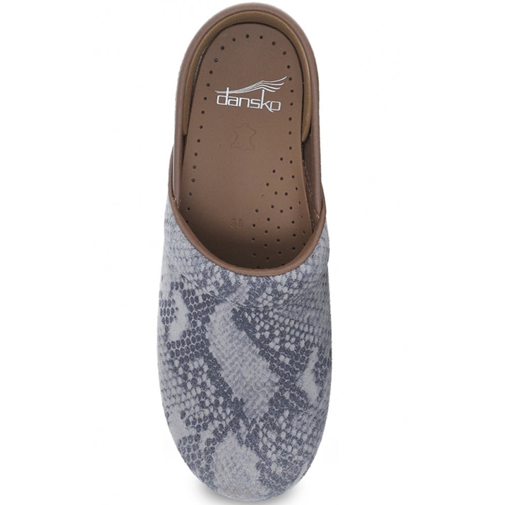 A single grey and white patterned Dansko Professional Taupe Suede Snake clog shoe, featuring an anti-fatigue rocker bottom, viewed from above.