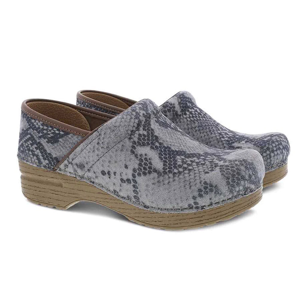 A pair of gray, snake-skin patterned Dansko Prof Taupe Suede Snake clogs with a wooden sole on a white background.
