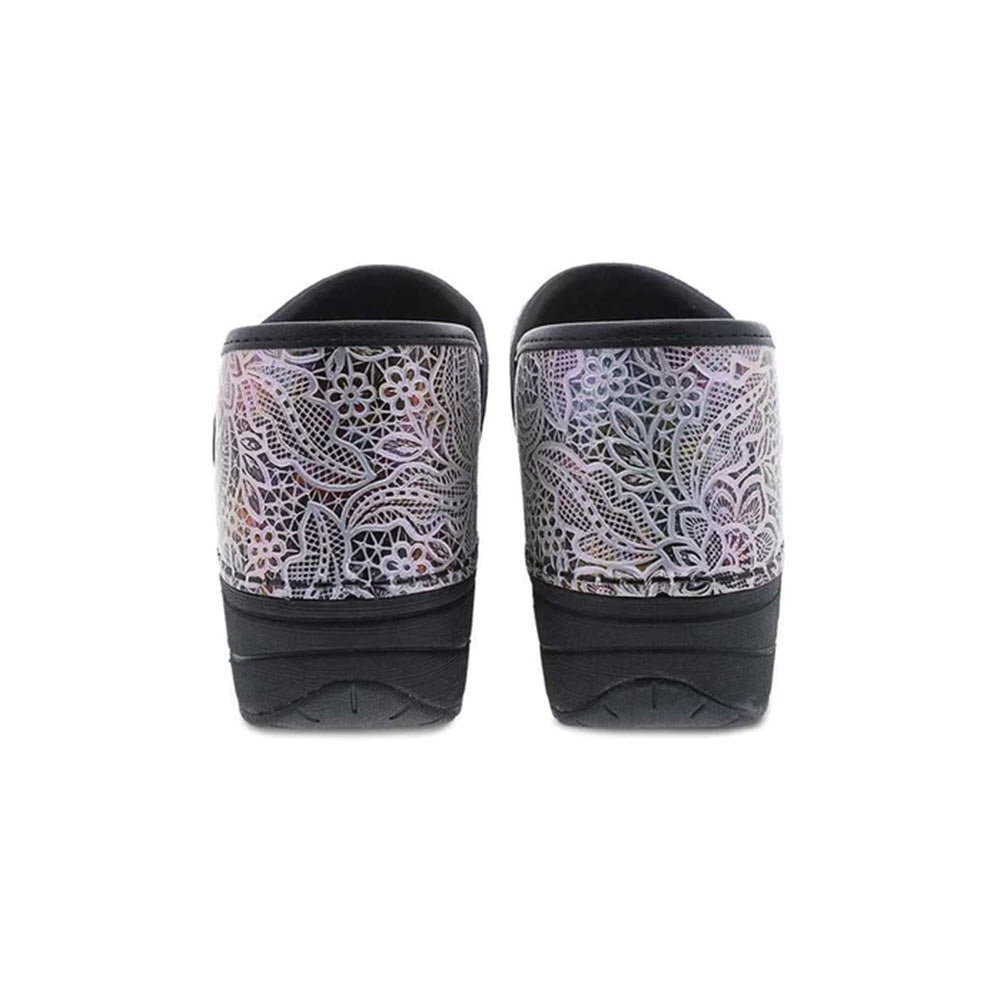 A pair of Dansko PRO XP 2.0 LACY LEATHER - WOMENS black sandals with patterned lace straps on a white background.
