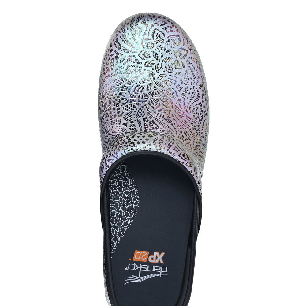 A patterned Dansko PRO XP 2.0 LACY LEATHER slip-on shoe with a floral design on a white background.