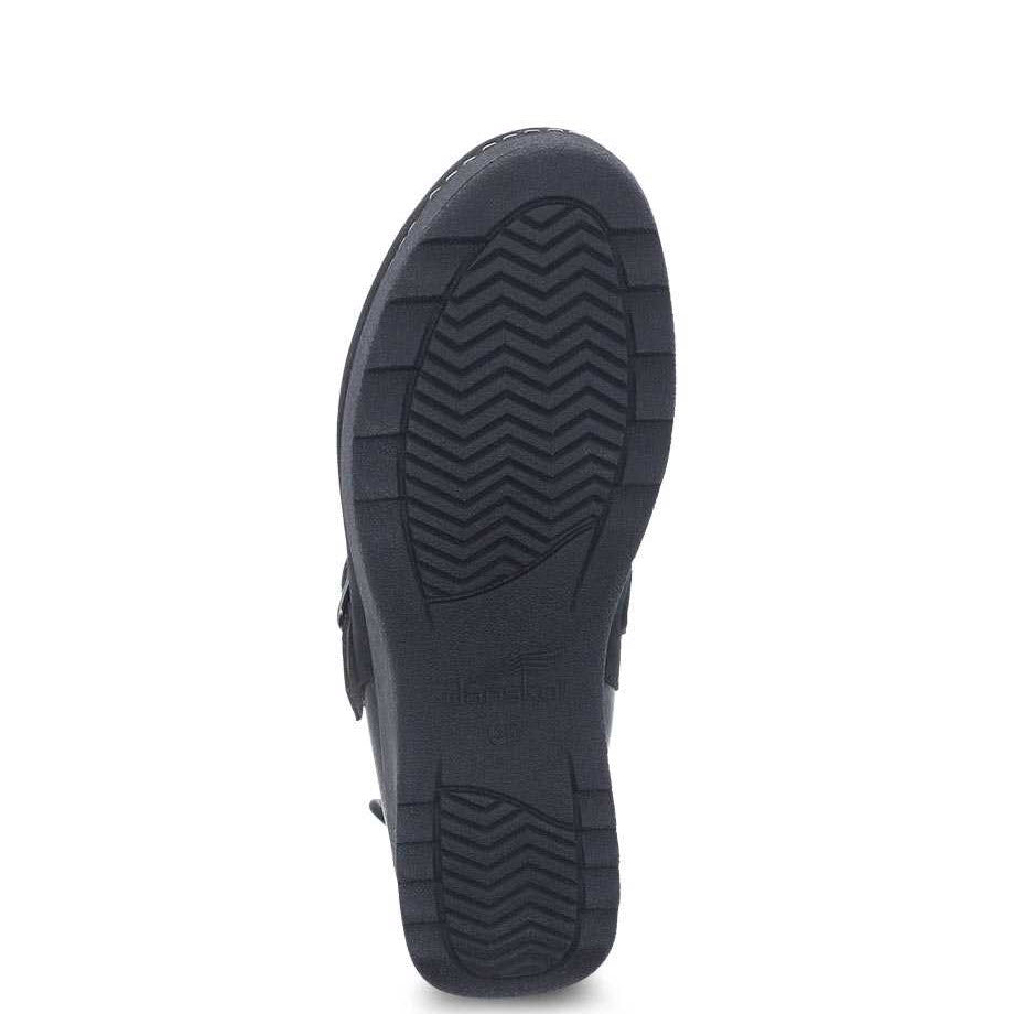 Sole of a casual Dansko Caia Black Milled mule displaying tread pattern.
