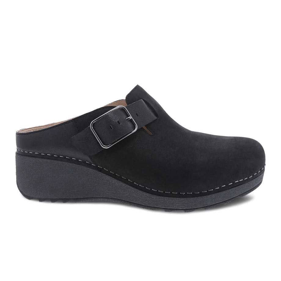 Dansko Dansko Caia Black Milled clog with buckle on white background, featuring stain resistance.