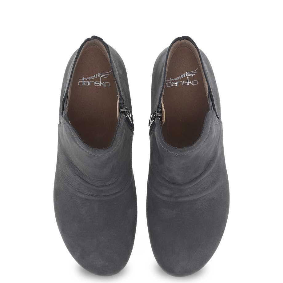 A pair of gray Dansko Caley Grey Milled clogs with stain resistance photographed from above.