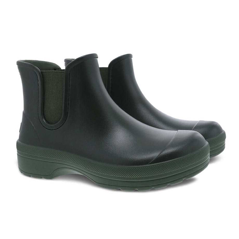 A pair of black &quot;Dansko Karmel Rain boot&quot; ankle-height rain boots against a white background.