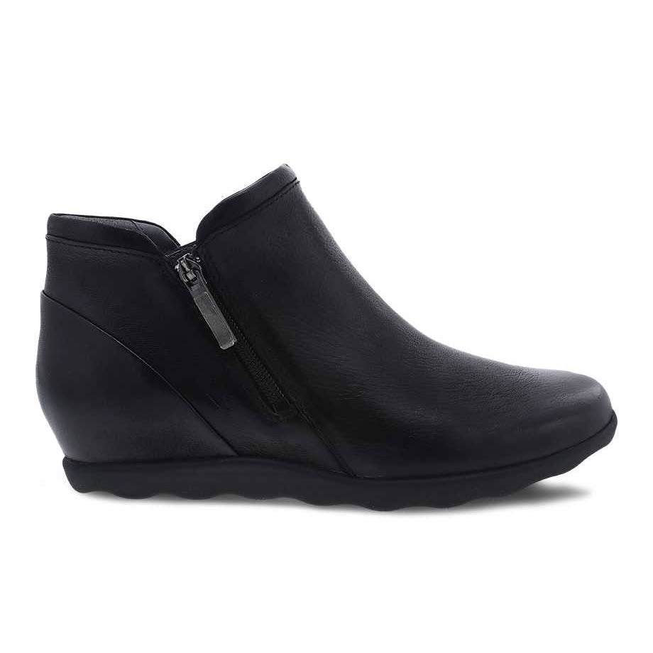 Dansko Miki black burnished nubuck leather wedge ankle boot with a side zipper, isolated on a white background.