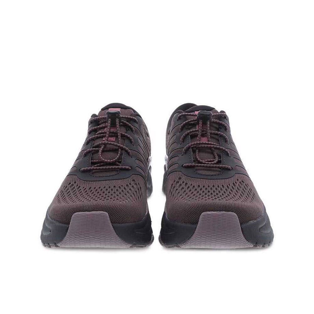 A pair of brown Dansko Penni Raisin Mesh athletic shoes viewed from the front.