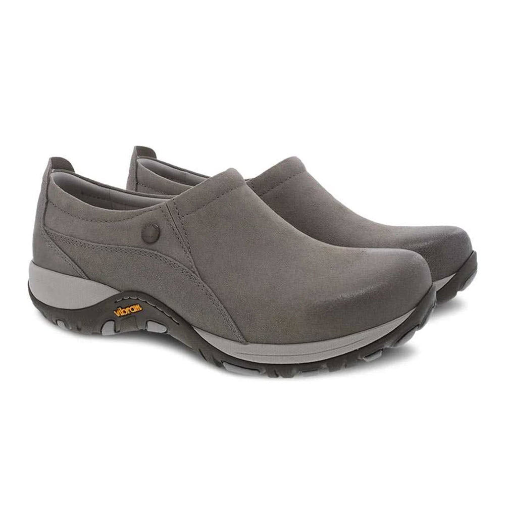 A pair of Dansko Patti Taupe Burnished slip-on casual shoes with rubber soles and lightweight, flexible design.