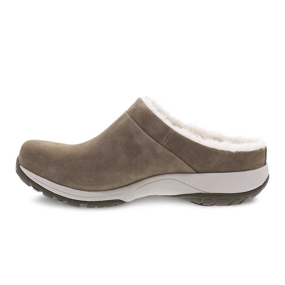 A single Dansko Parson Walnut Burnished slip-on shoe, featuring Dansko Natural Arch Technology and white fluffy lining, with a thick Vibram rubber outsole.