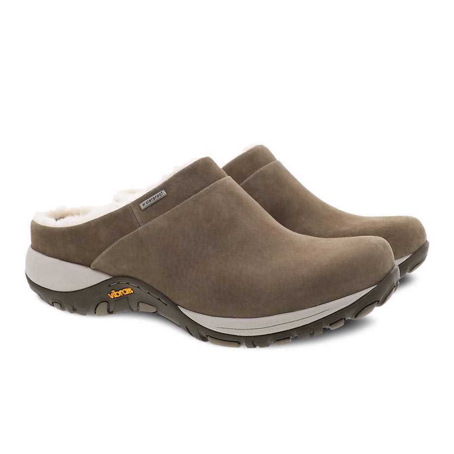 Pair of Dansko Parson Walnut Burnished slip-on shoes, featuring stain-resistant suede, on a white background.