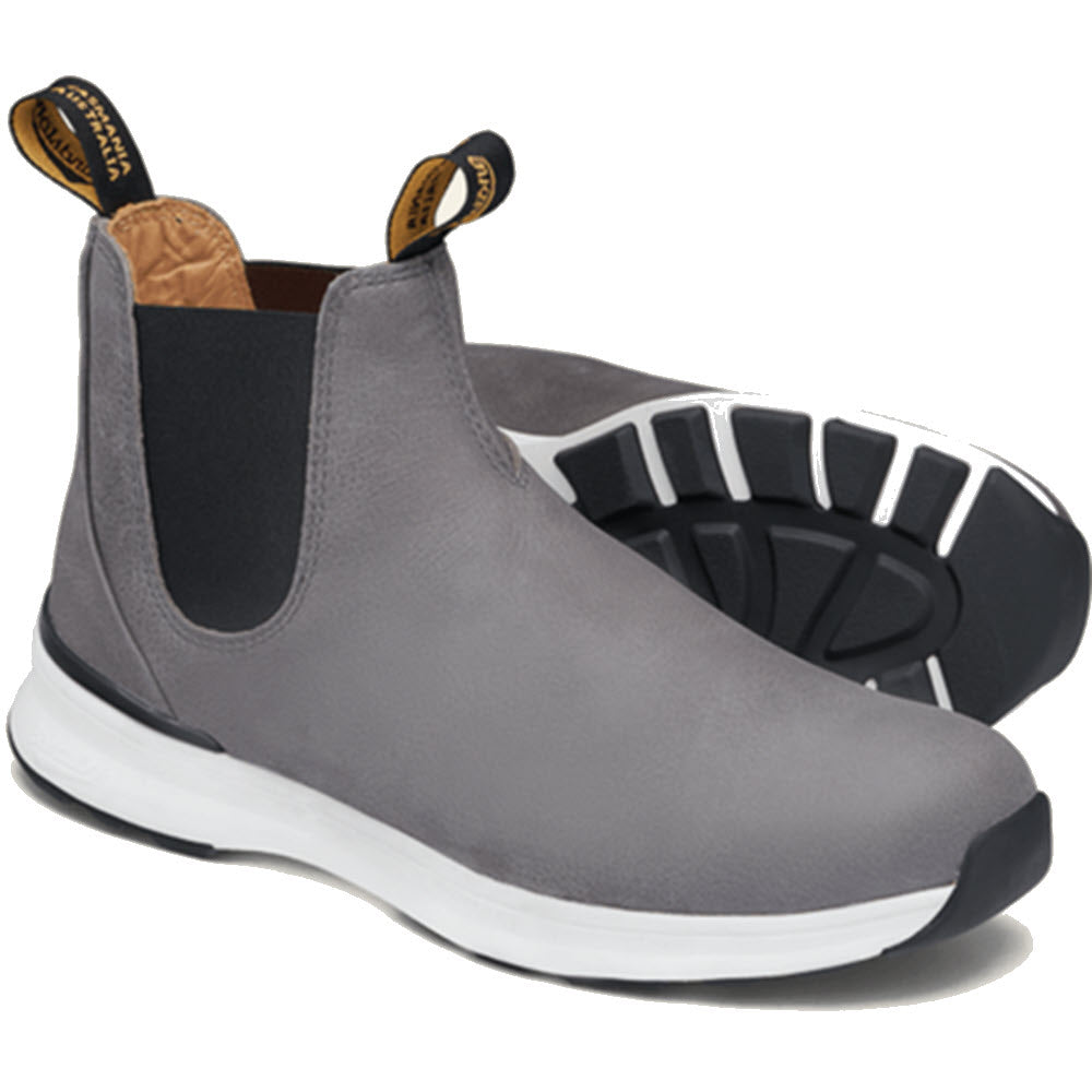 A pair of Blundstone Active Dusty Grey - Womens suede leather slip-on sneakers with white soles and pull tabs on the heels.