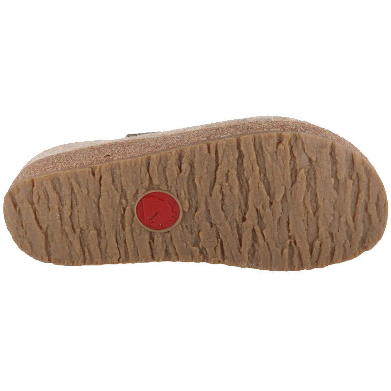 Sole of a Haflinger Kris Tan Clog by Haflingers displaying its textured pattern and a red brand logo.