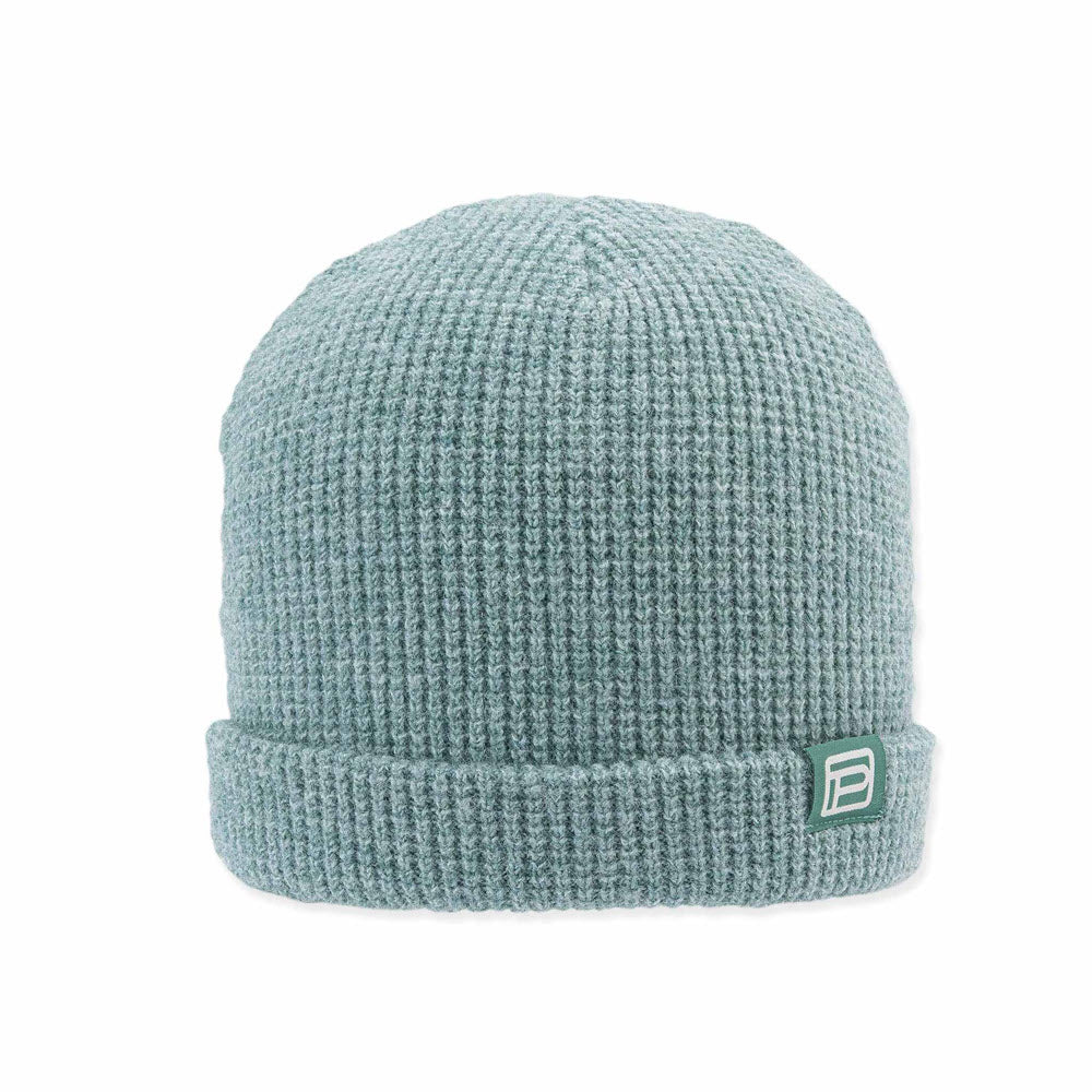 A light blue chunky waffle-knit Pistil Cassie hat Aqua with a small white and green brand logo on the fold.