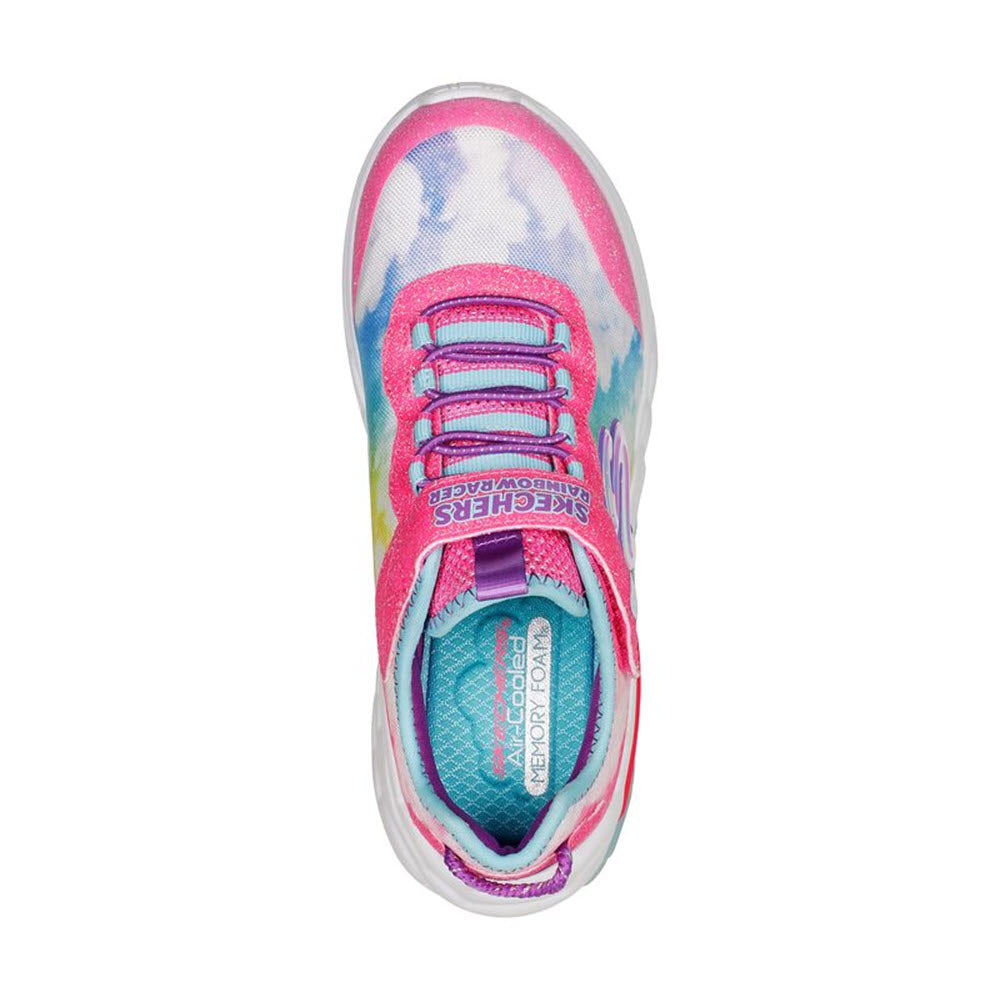 Top view of a Skechers Rainbow Racer Pink Multi - Kids slip-on sneaker with pink laces and a blue insole, featuring a blend of pink and blue patterns.