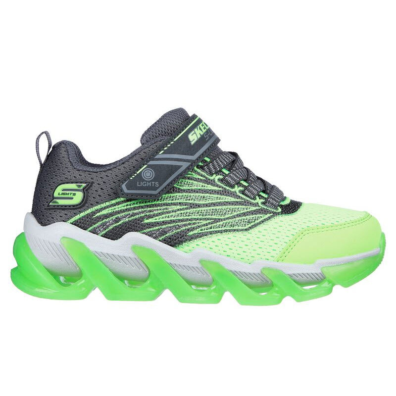 A neon green and black children&#39;s sneaker with Skechers Mega Surge Charcoal/Lime and the Skechers logo.