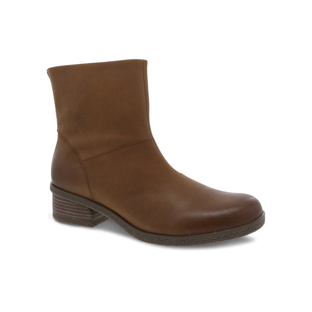 Dansko brown leather ankle boot with a low, stacked heel and smooth finish, featuring Dansko Natural Arch technology, on a white background.