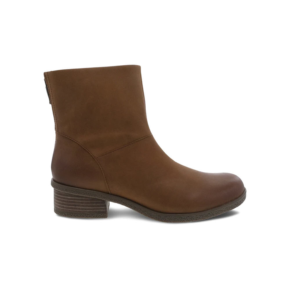 A brown, mid-height Dansko boot with a heel.