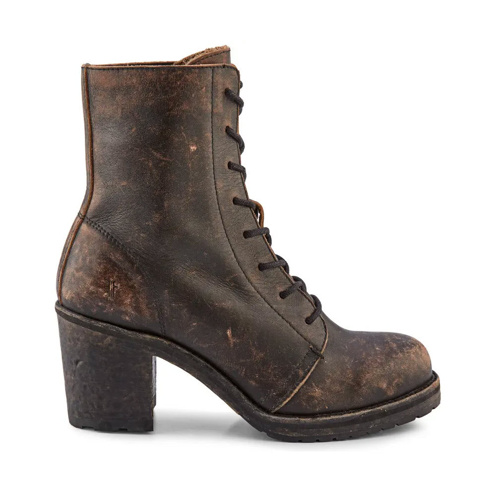 A worn brown vegetable-tanned vintage leather Frye Karen Combat Black Distressed lace-up boot with a chunky heel, isolated on a white background.