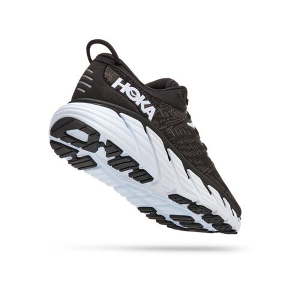 A single HOKA ONE ONE Gaviota 4 stability shoe with thick cushioning and J-Frame technology, featuring a black and white color scheme.