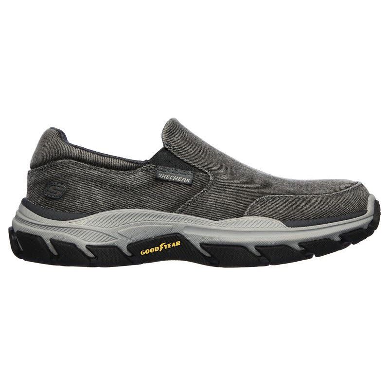 A single black and gray Skechers FALSTON CHARCOAL CANVAS slip-on sneaker with a Goodyear performance outsole.