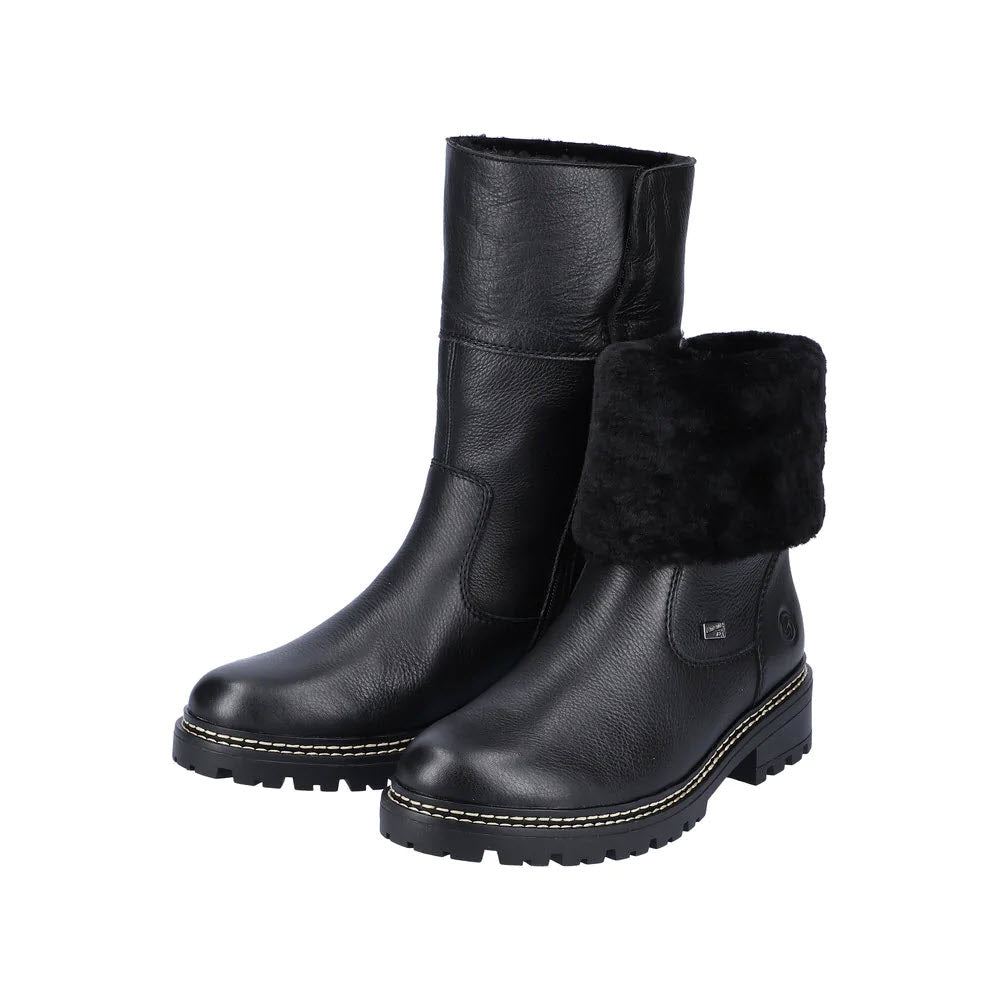 A pair of Remonte black leather mid-calf boots with a fur lining at the top on a white background.