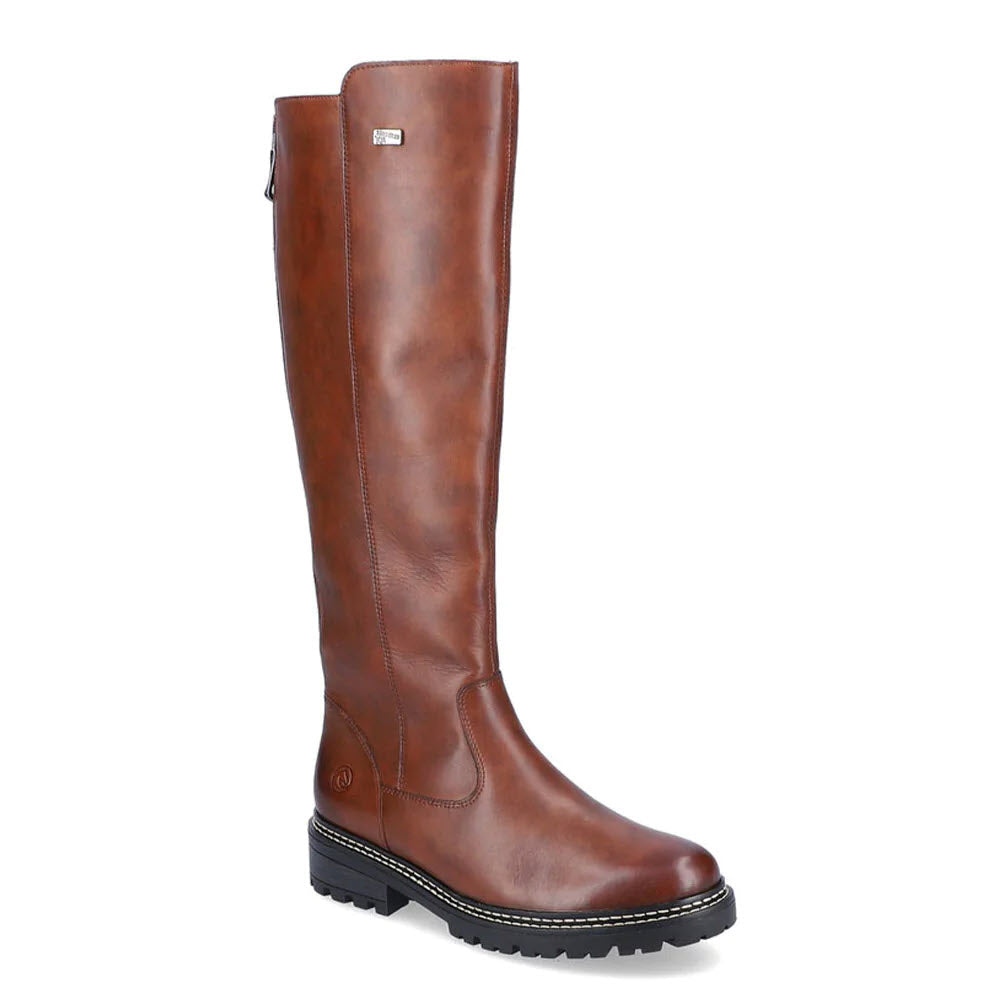A tall tan leather women's boot with a thick black rubber sole, featuring a small Remonte logo on the side.