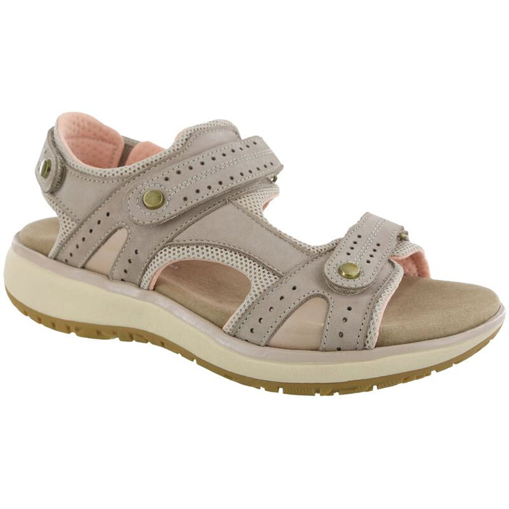 A single SAS EMBARK SANDAL TAUPE - WOMENS with adjustable straps and a cushioned sole against a white background.