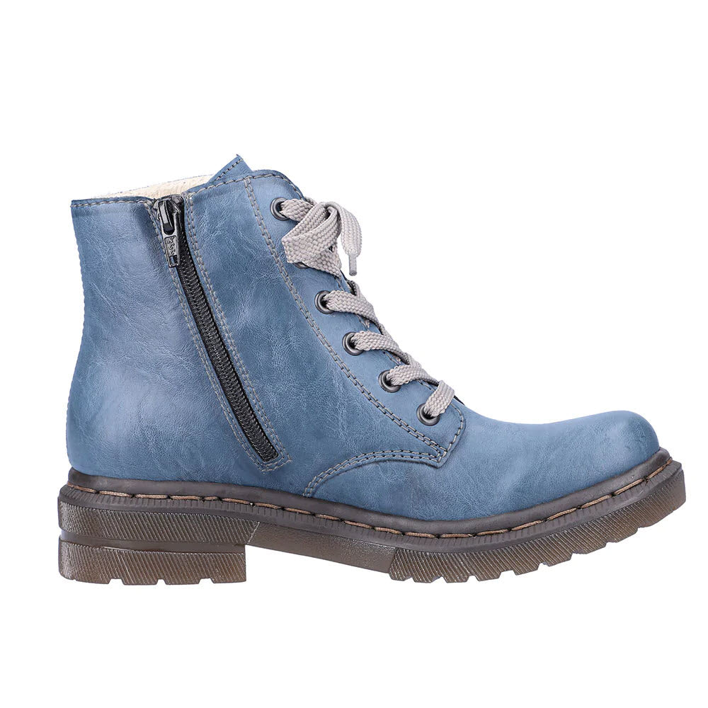 Blue Rieker combat bootie denim with lace-up fastening and side zipper on a white background.