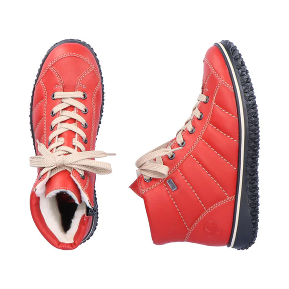 Two red, quilted RIEKER PUFF HIGH TOP FLAME winter boots with white laces and a waterproof membrane, displayed from a side and front angle against a white background.