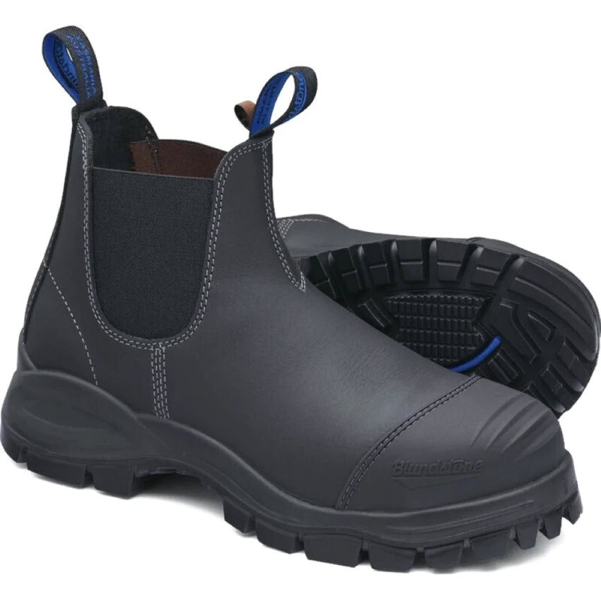 A pair of Blundstone 990 steel toe black leather pull-on safety work boots with blue loops.