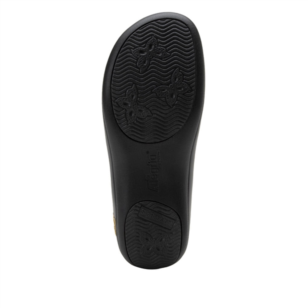 Black slip-resistant Alegria Keli Earthy Lux - Womens shoe sole with tread pattern and branding detail.
