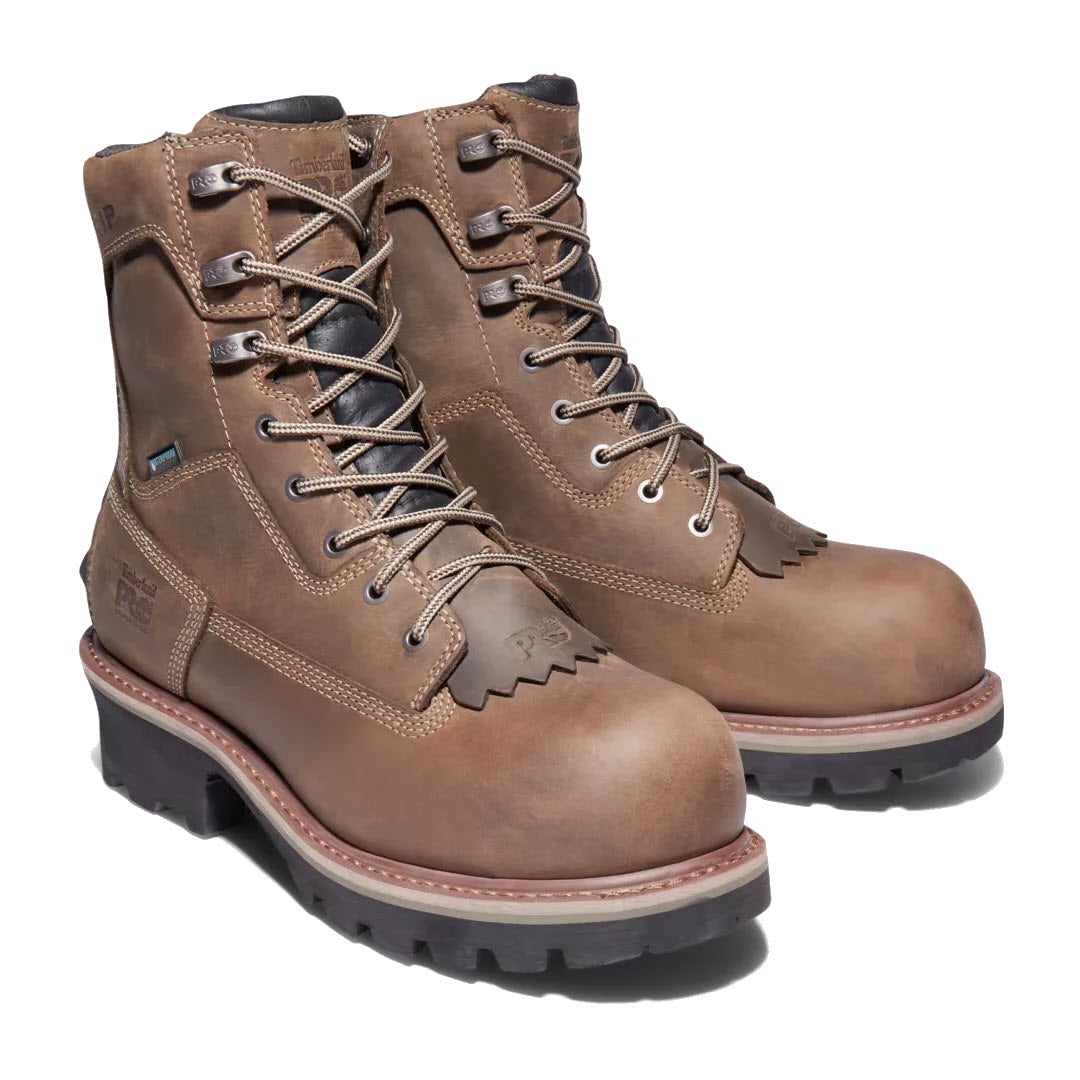 A pair of Timberland Evergreen NT Insulated Logger coffee men&#39;s work boots with composite safety-toe, thick rubber soles, and lace-up fronts, isolated on a white background.