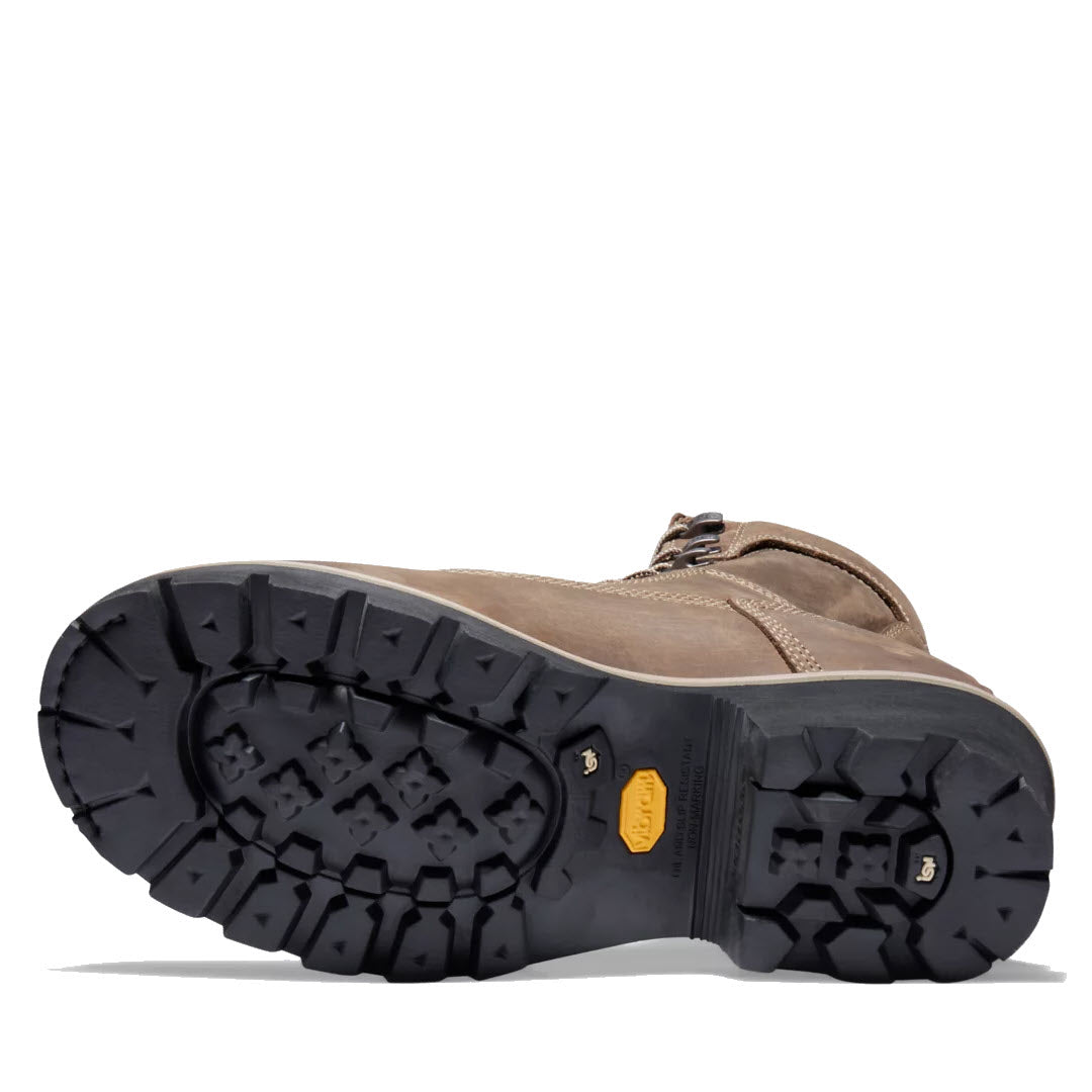 A pair of Timberland Evergreen NT Insulated Logger Coffee - Mens shoes with thick black soles, featuring electrical hazard protection and a visible Timberland logo on the sole.