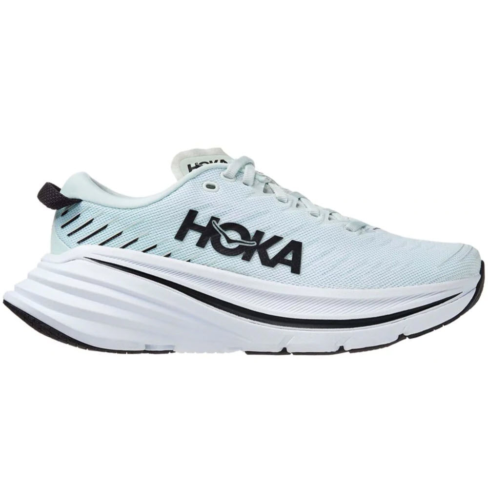 A Hoka running shoe with a thick, white sole and a light blue upper, featuring a carbon-fiber plate.