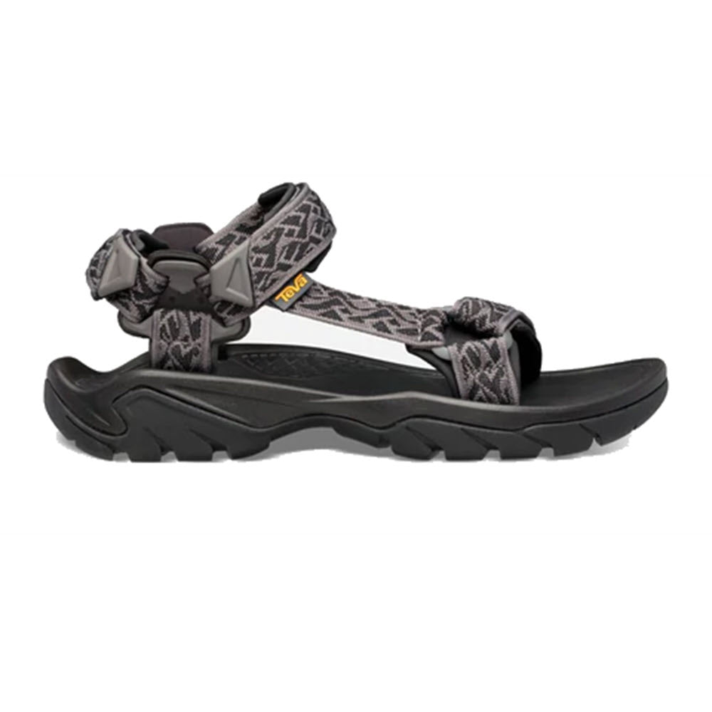 Black and gray patterned Teva Terra Fi 5 Universal sports sandal with adjustable straps on a white background.