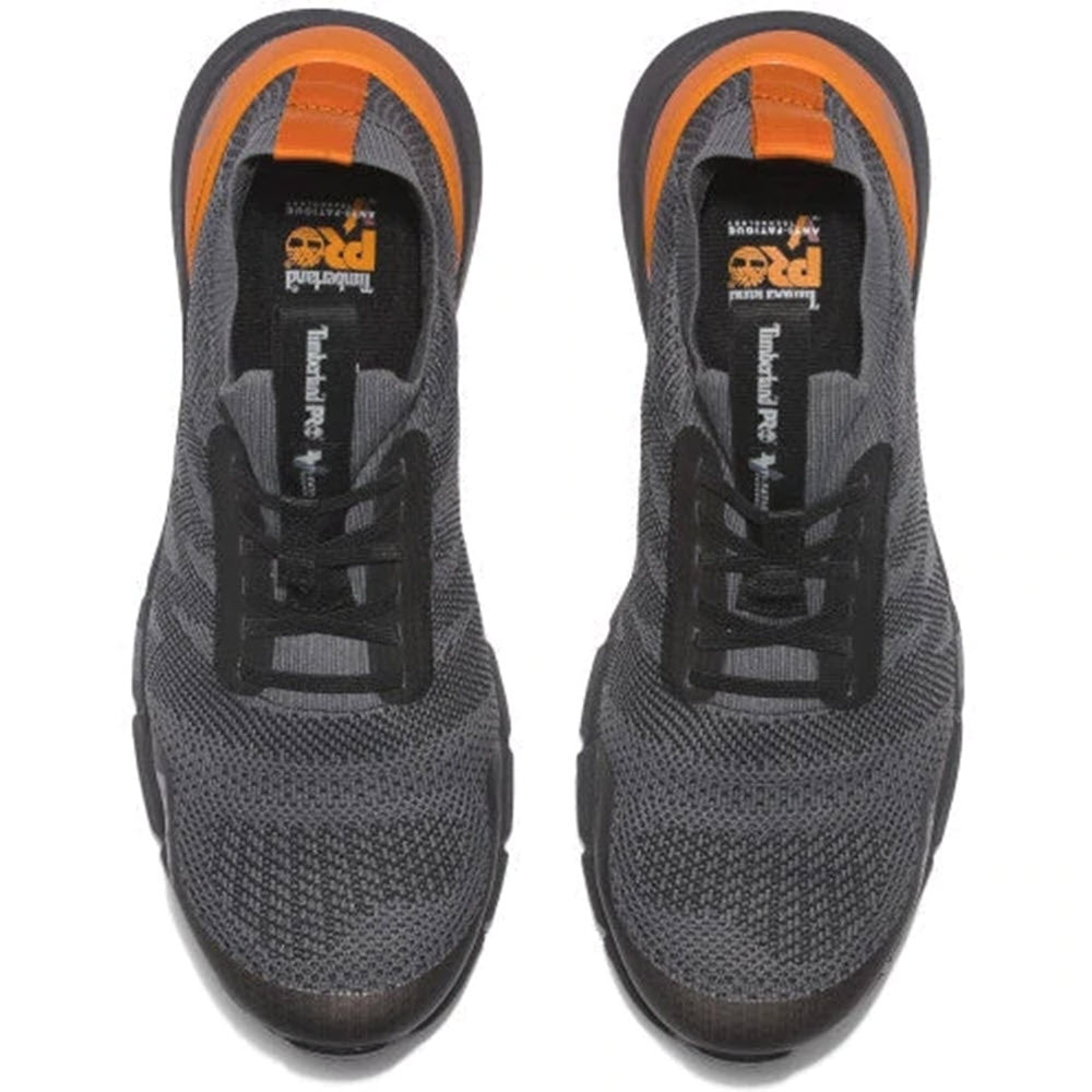 A pair of new Timberland athletic shoes with HoverSpring™ foam midsole and black laces is viewed from above.