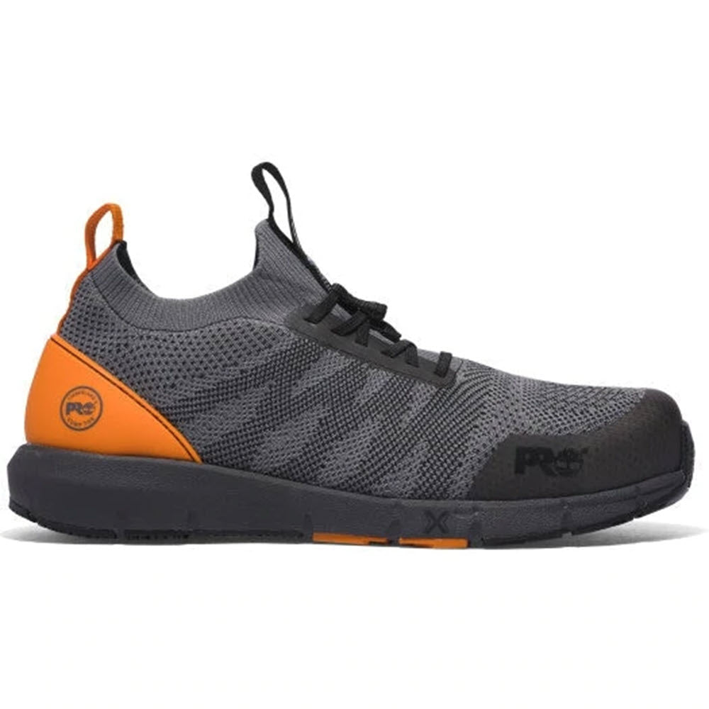 Timberland gray and orange athletic shoe with composite safety toes, black laces, and a slip-resistant sole.