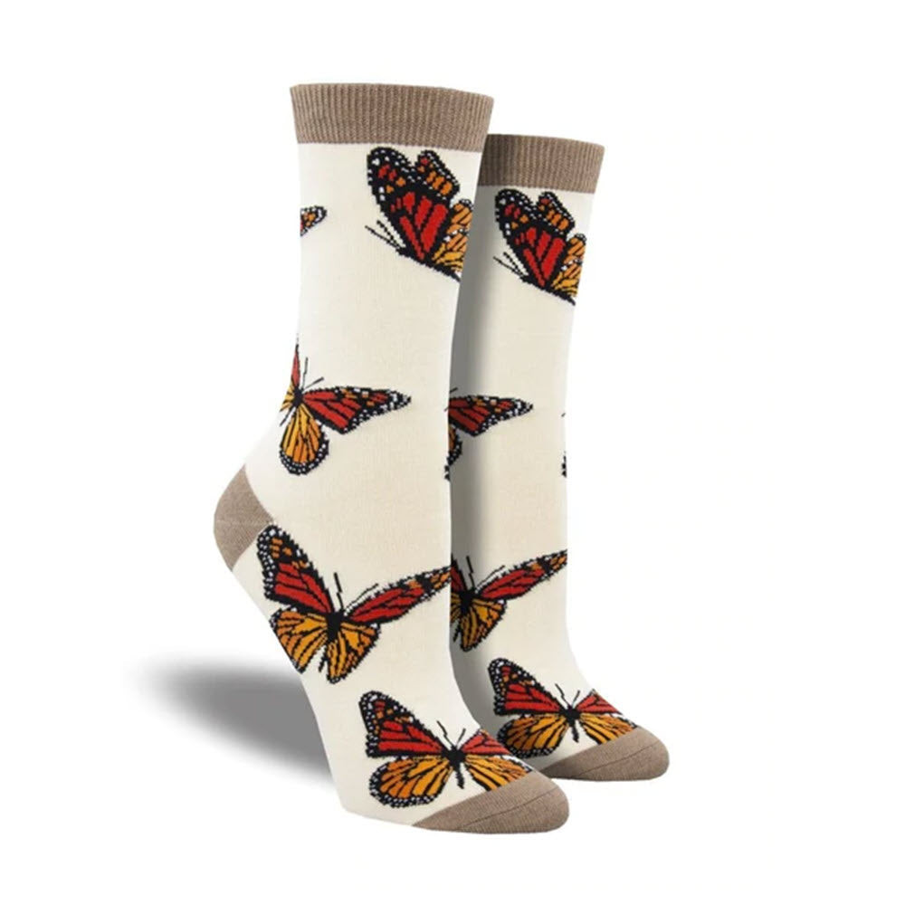 A pair of cream-colored Socksmith Monarchy socks adorned with orange and black monarch butterfly patterns.