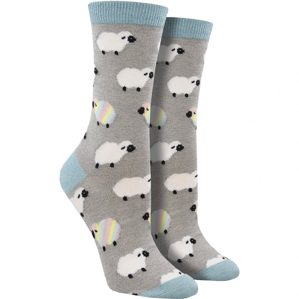 A pair of Socksmith Ewenique gray socks with sheep and rainbow motifs against a white background, size 9-11.