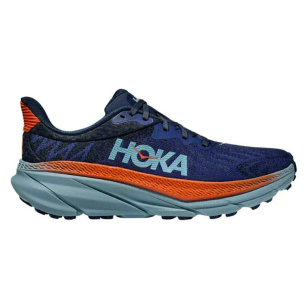 A HOKA CHALLENGER ATR 7 BELLWEATHER/STONE BLUE trail running shoe with blue upper, orange accents, and a thick, grey sole.