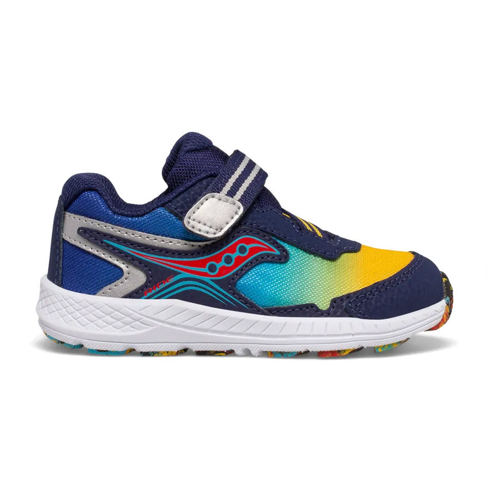 A colorful children's Saucony sneaker with blue, yellow, and red leather and mesh upper sections, featuring a velcro strap and elastic laces on a white background.