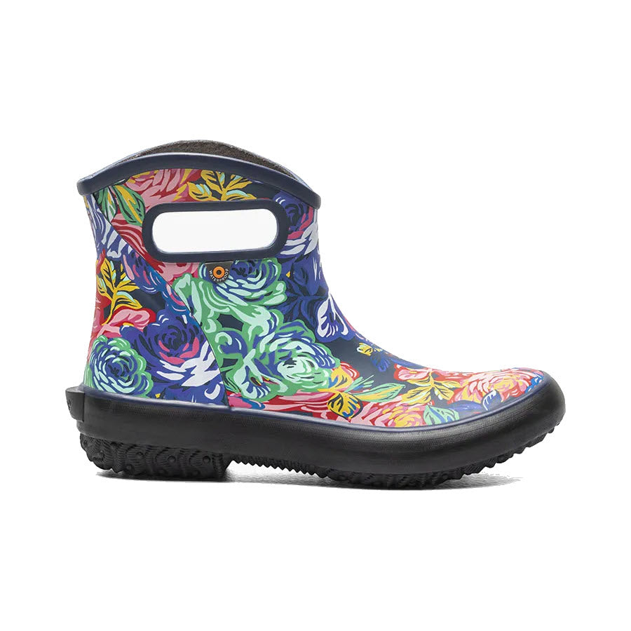 A colorful floral patterned ankle rain boot with BOGS PATCH ANKLE ROSE GARDEN MULTI - WOMENS eco-friendly footbed isolated on a white background.